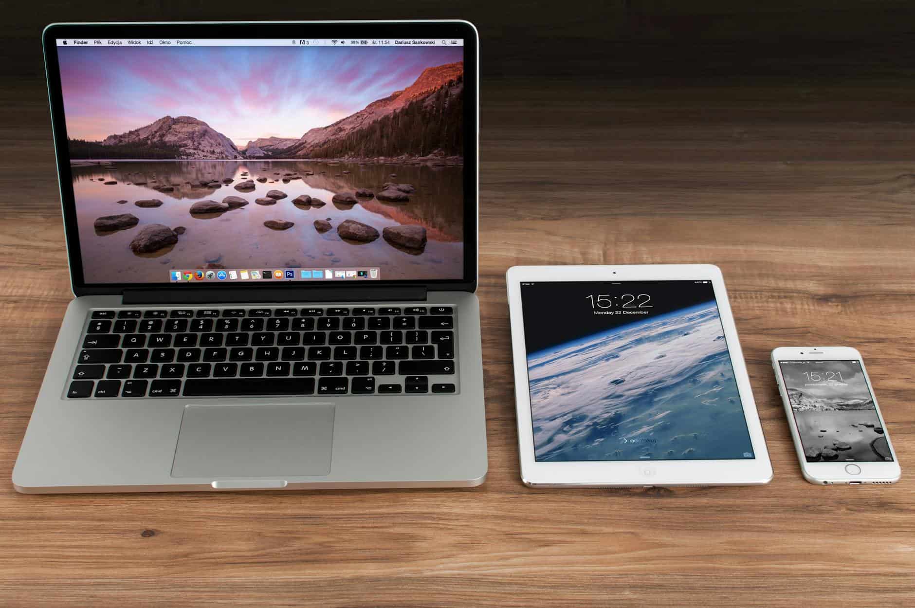 Macbook Pro Beside White iPad