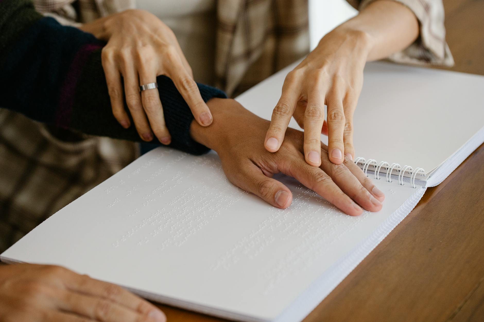 Blind person reading braille text