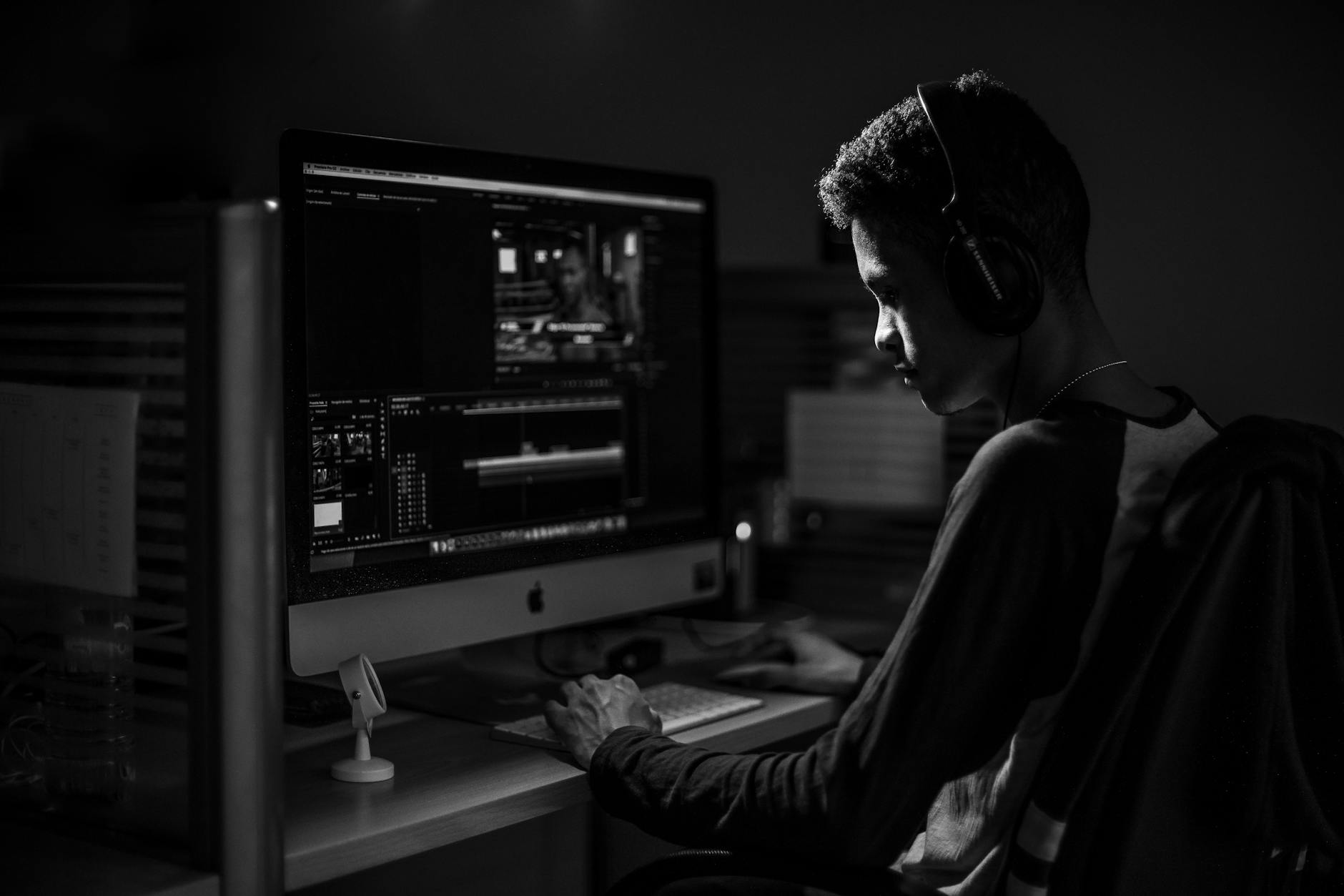 Man in Raglan Sleeve Shirt Using Computer